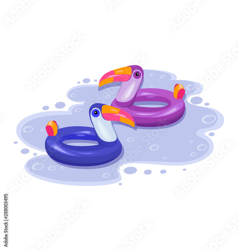 Toucan. Two inflatable toucans, tropical bird shape inflatable swimming pool ring. Summer vacation holiday rubber object, traveling, beach ocean. Blue and violet, bright birds on water surface.