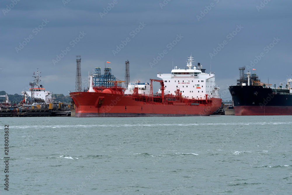 Southampton Water, England, UK, September 2019. Chemical, oil products tankers off loading cargo at a refinery.