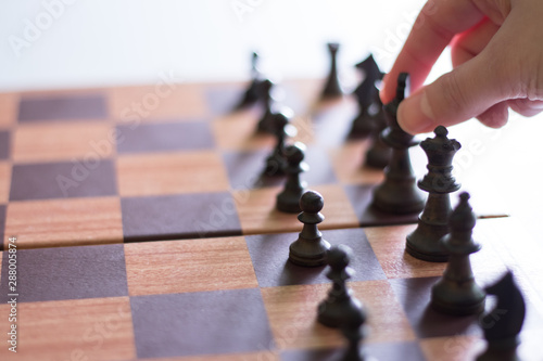 Woman About to Make a Move in Chess