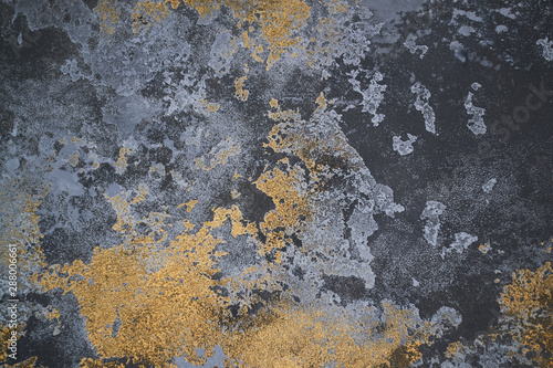 Gray golden texture of decorative plaster for walls and concrete. seamless background