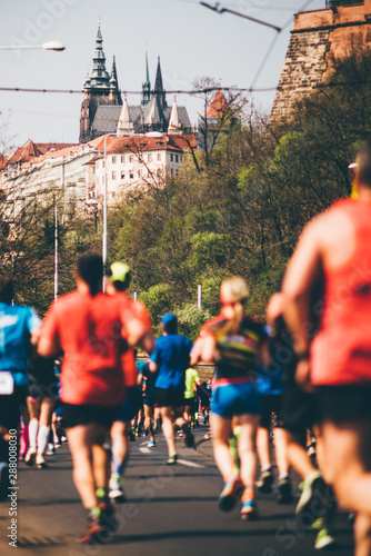 Marathon runners in the Prague. Multiracial runners in the sity centre.