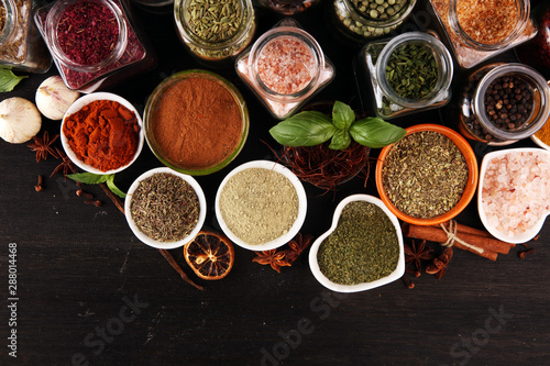 Spices and herbs on table. Food and cuisine ingredients with pepper © beats_