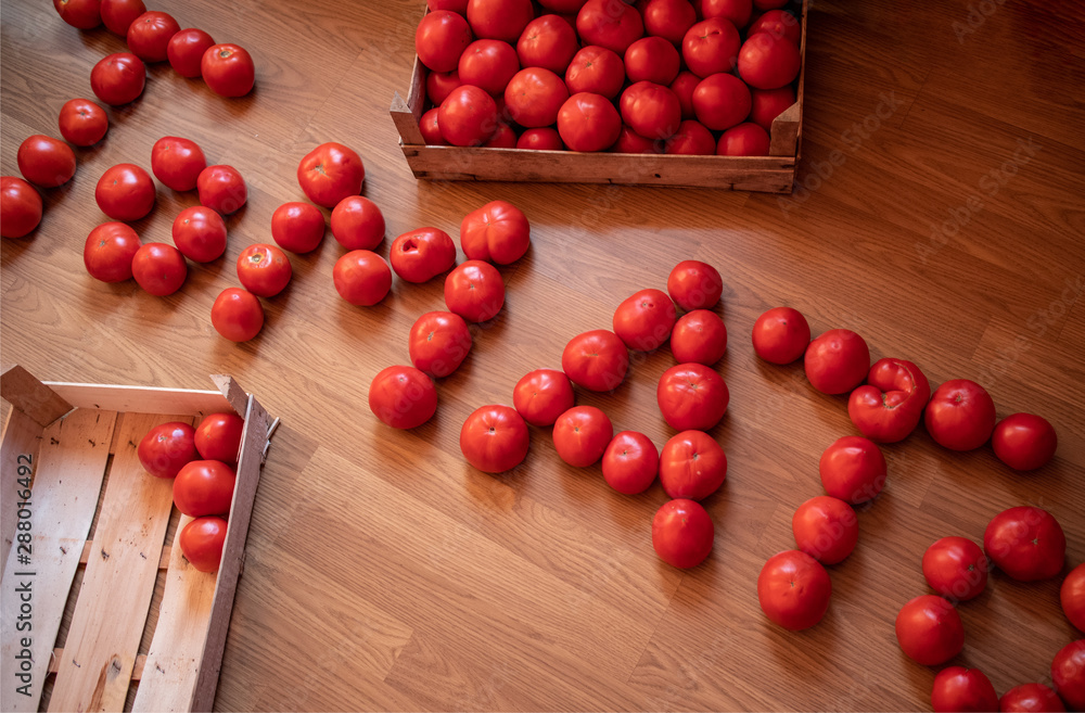 Word TOMATO made of raw fresh organic tomatoes Word TOMATO made of raw fresh organic tomatoes
