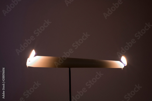 Burning the candle at both ends illustration