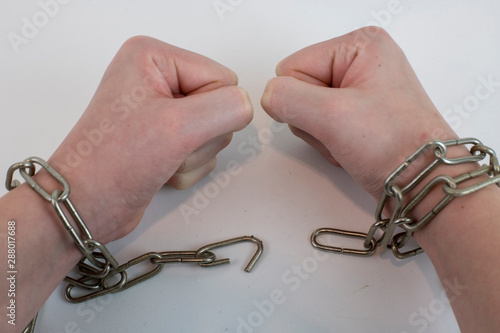 Hands chained together as an illustration to being trapped
