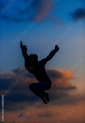Athletic dancer in a super jumping pose