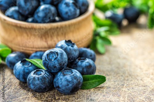 Fresh blueberries background with copy space for your text. Blueberry antioxidant organic superfood in a bowl concept for healthy eating and nutrition