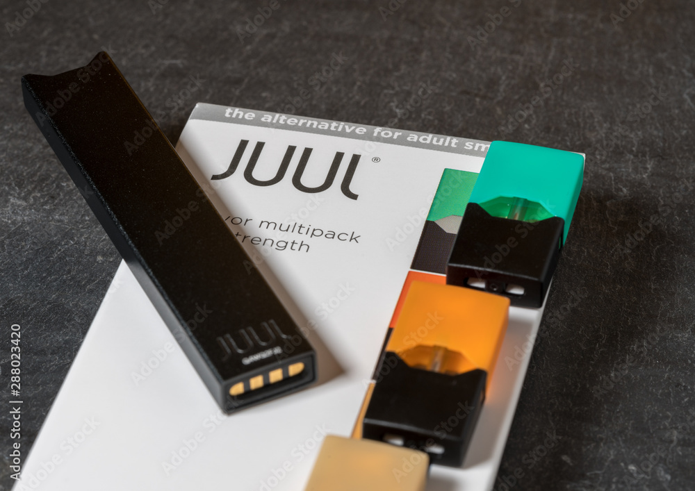 Box holding JUUL nicotine dispenser and pods Stock Photo | Adobe Stock