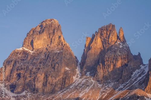Grohmann and Cinquedita at Sundown in the Dolomites showing the Mountains in a Orange Light. View from Passo Sella