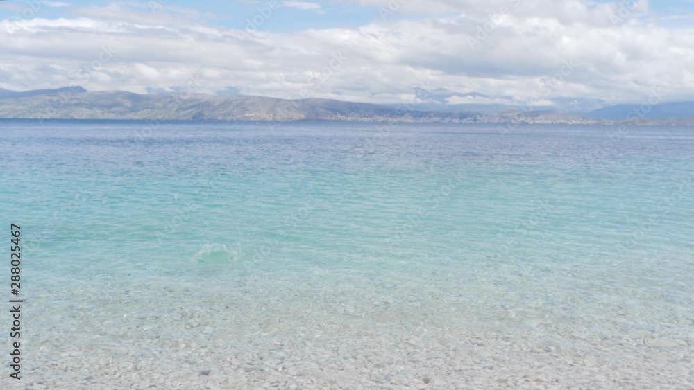Stone skipping on crystal clear seawater. Stone skipping on crystal clear seawater.