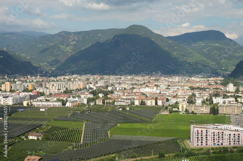 Bolzano, beautiful City in South Tyrol. Bozen is the capital of Südtirol and is a Alpine City. High Rise Buildings and Field in the foreground