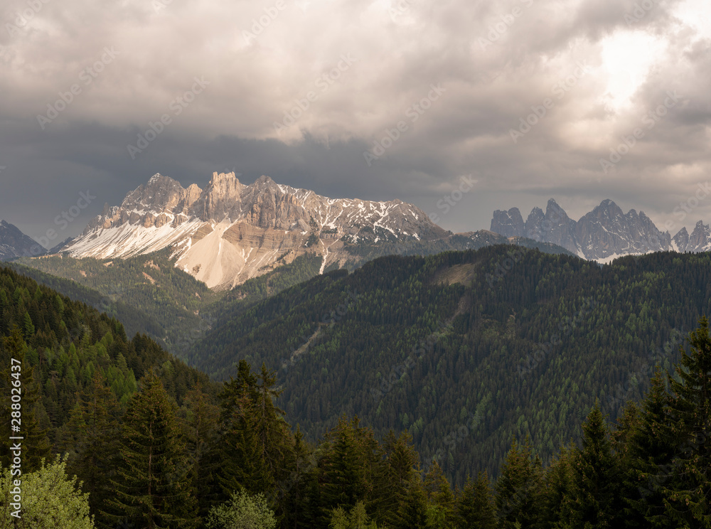Aerial Landscape of the Dolomites, Sunset on a cloudy Day giving the Aferer Geisler Mountain a nice color.