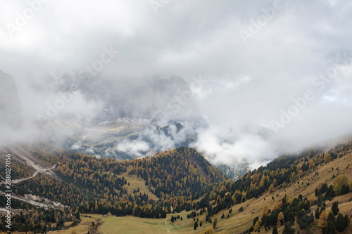 Sassolungo covered in Clouds, and Sella Mountain on the Left in the Dolomites above Val Gardena in South Tyrol