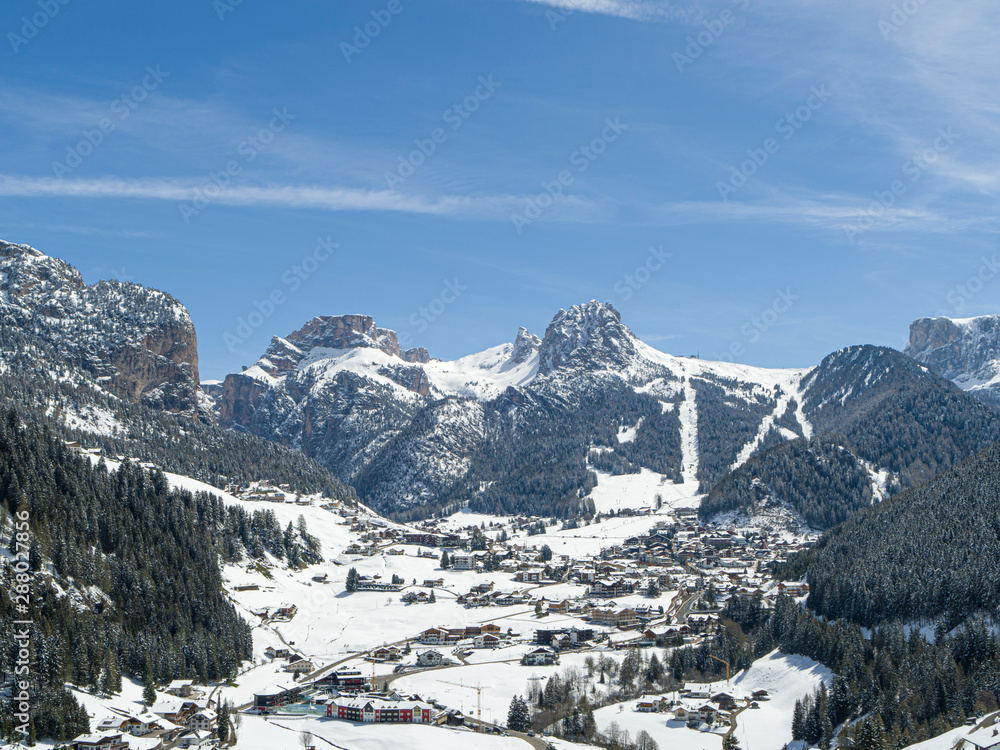 Selva Val Gardena during a sunny winter Day surrounded by the Dolomites in South Tyrol
