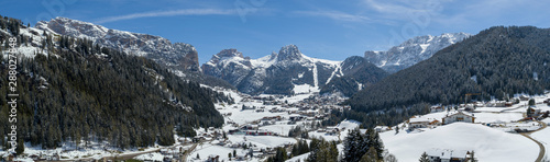 Selva Val Gardena during a sunny winter Day surrounded by the Dolomites in South Tyrol