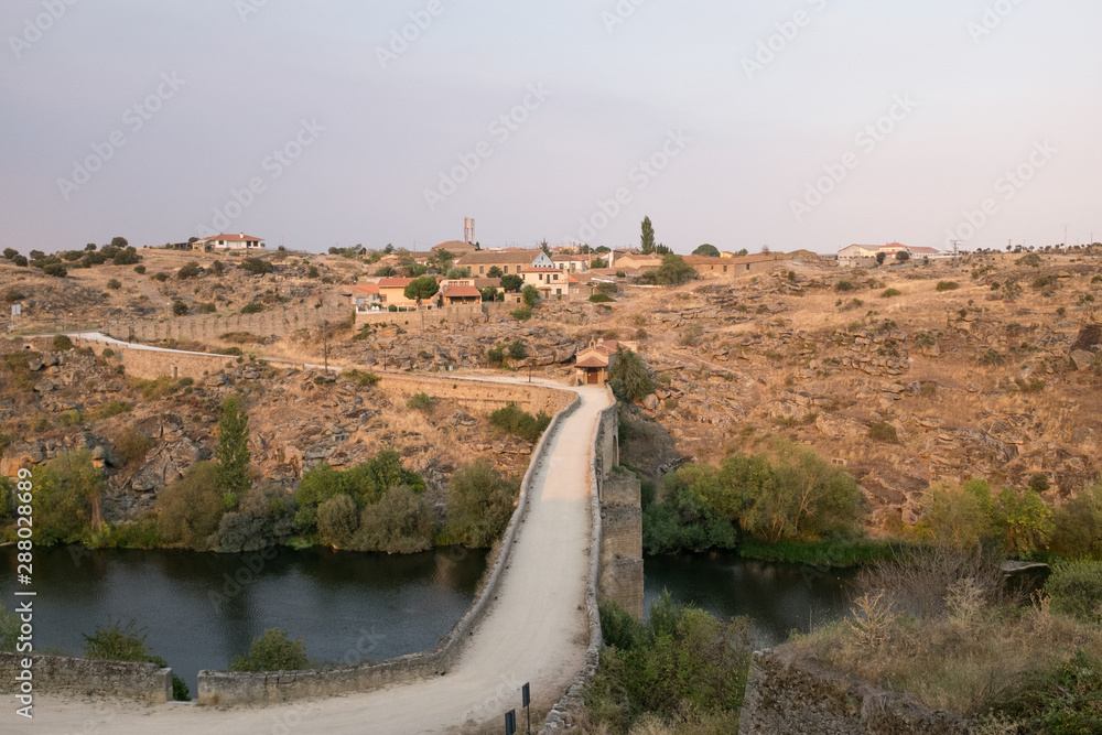 Fototapeta premium landscape of the ledesma river as it passes through the town of Ledesma