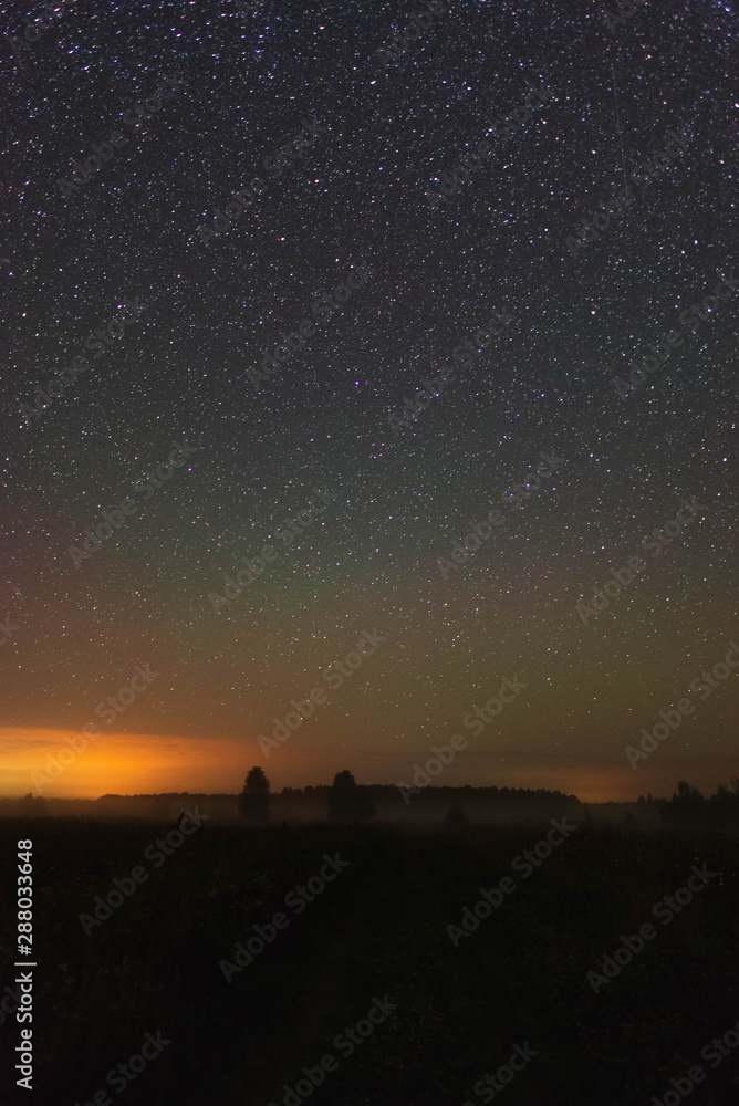 Starry sky over the road in the field Starry sky over the road in the field
