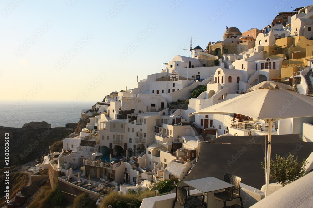 View of Oia the most famous village of Santorini Island in Greece with white houses and windmills