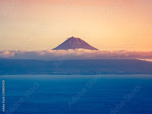 Image of the volcano mountain of pico in beautiful sunset colors photo