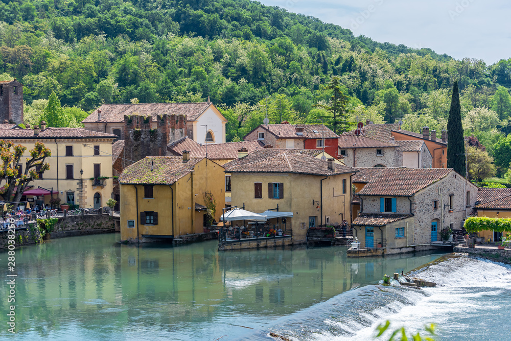 Fototapeta premium Landscape of little italian town by the river