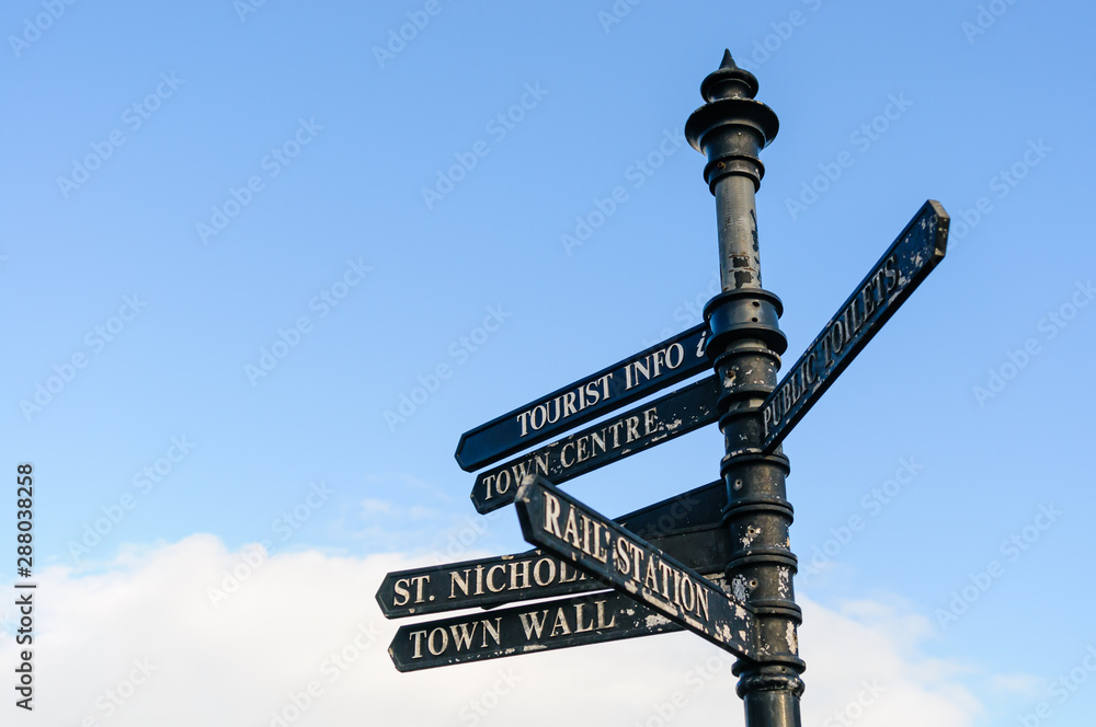 Fototapeta premium Direction signs against blue sky