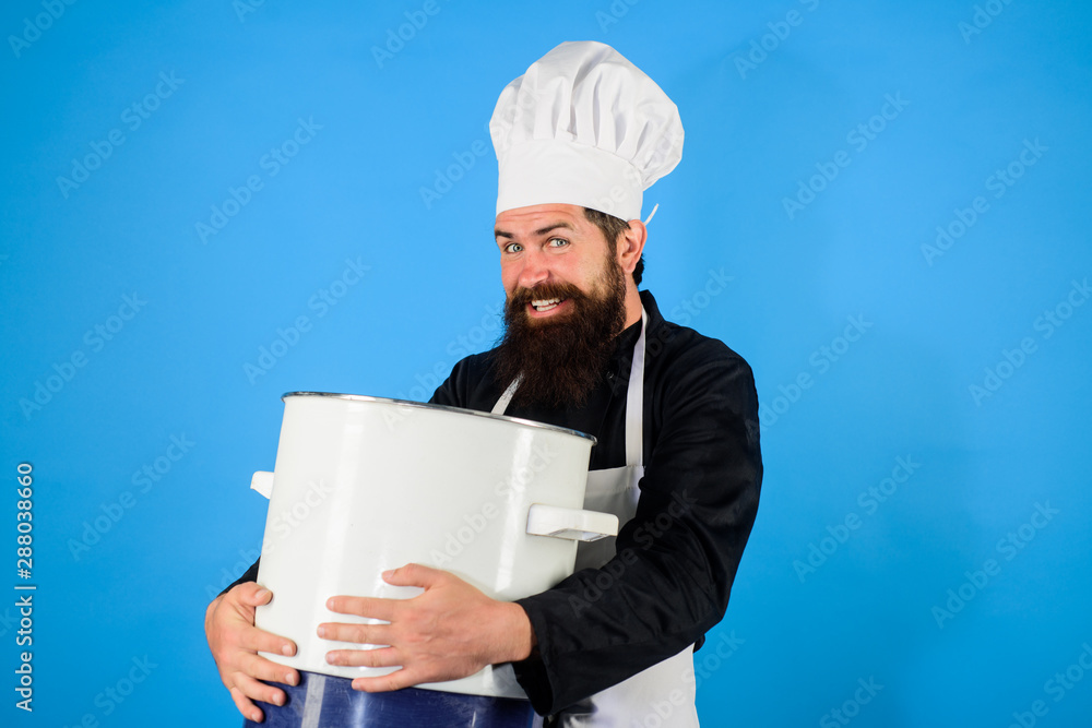 Chef, cook or baker with saucepan in hand. Professional chef in uniform and hat holds pan. Cooking, food, profession concept - male chef holds pot. Chef in uniform cooking with casserole. Cooking pot. Chef, cook or baker with saucepan in hand. Professional chef in uniform and hat holds pan. Cooking, food, profession concept - male chef holds pot. Chef in uniform cooking with casserole. Cooking pot.
