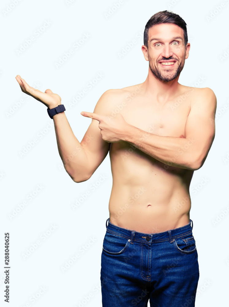 Handsome shirtless man showing nude chest amazed and smiling to the camera while presenting with hand and pointing with finger. Handsome shirtless man showing nude chest amazed and smiling to the camera while presenting with hand and pointing with finger.