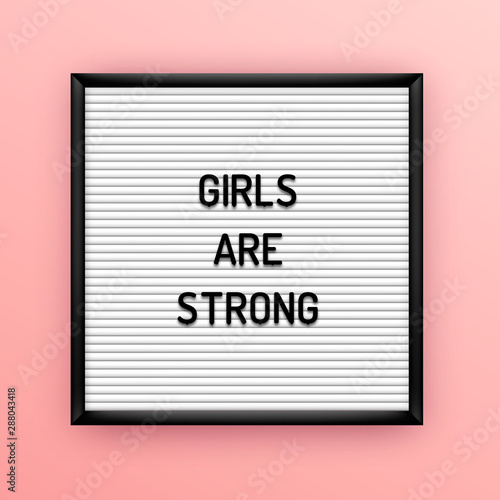 Feministic quote on square white letterboard with black plastic letters. Feminine vintage inspirational poster 80x, 90x. Girls are strong
