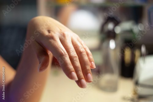 Beautiful female hand with fresh manicure after massage.