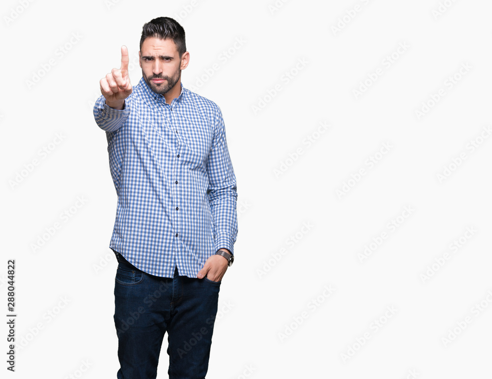 Young handsome man over isolated background Pointing with finger up and angry expression Young handsome man over isolated background Pointing with finger up and angry expression