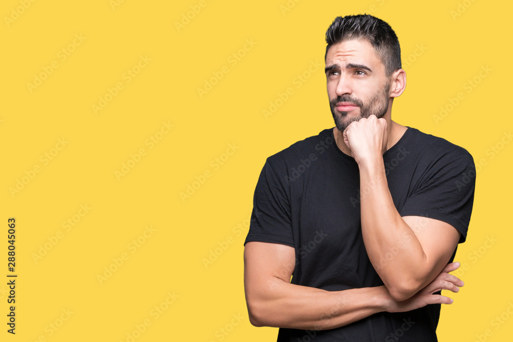 Young handsome man over isolated background with hand on chin thinking about question, pensive expression. Smiling with thoughtful face. Doubt concept. Young handsome man over isolated background with hand on chin thinking about question, pensive expression. Smiling with thoughtful face. Doubt concept.