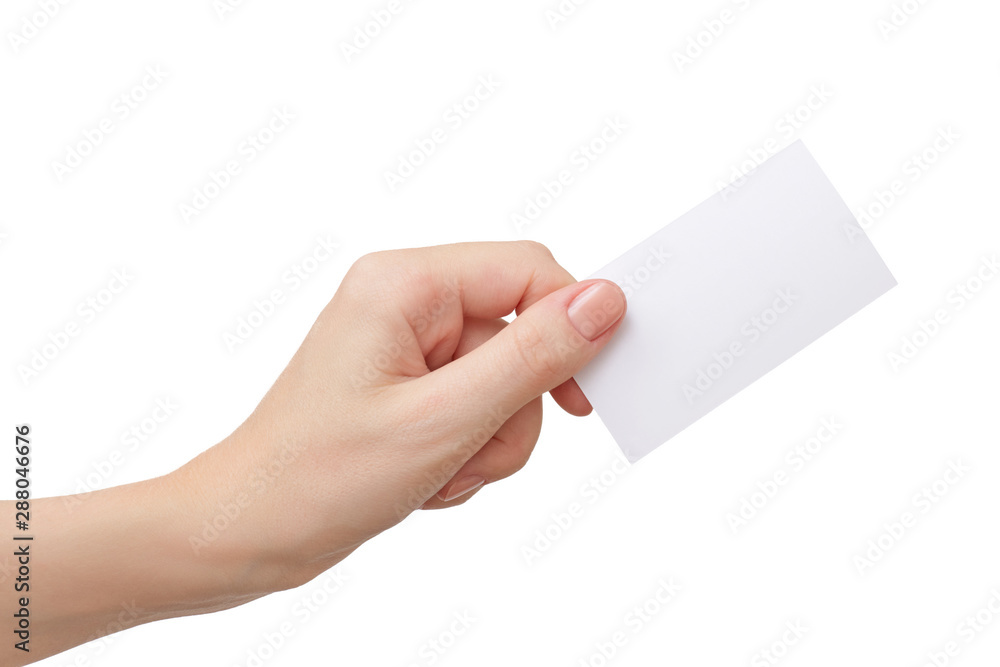 Female hand holding blank paper business card isolated on white Female hand holding blank paper business card isolated on white