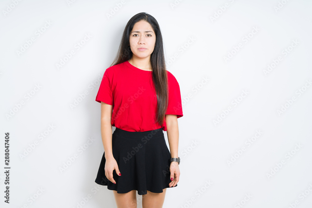Beautiful brunette woman wearing red t-shirt and skirt over isolated background depressed and worry for distress, crying angry and afraid. Sad expression. Beautiful brunette woman wearing red t-shirt and skirt over isolated background depressed and worry for distress, crying angry and afraid. Sad expression.