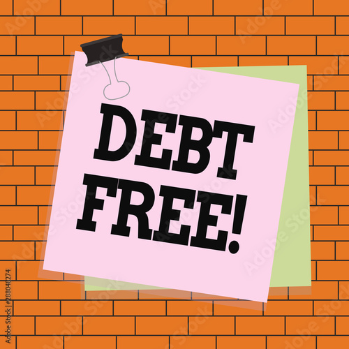 Text sign showing Debt Free. Business photo text does not owning any money or things to any individual or companies Paper stuck binder clip colorful background reminder memo office supply