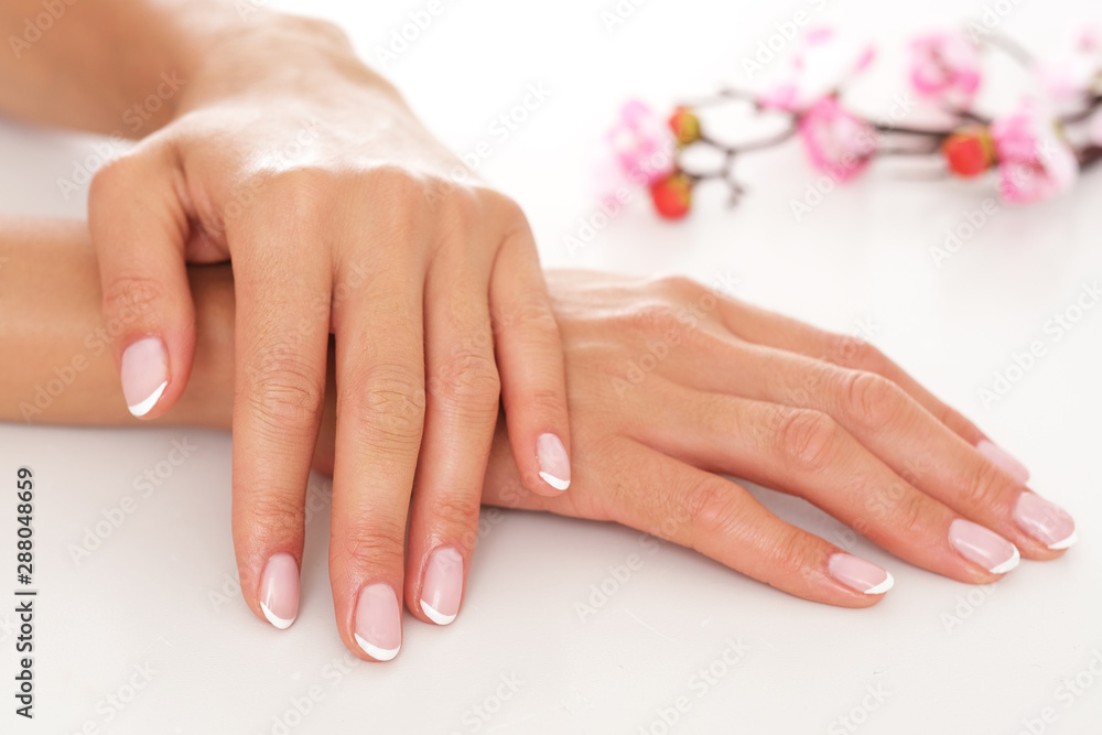 Smooth and well moisturized female hands on white background. Smooth and well moisturized female hands on white background.