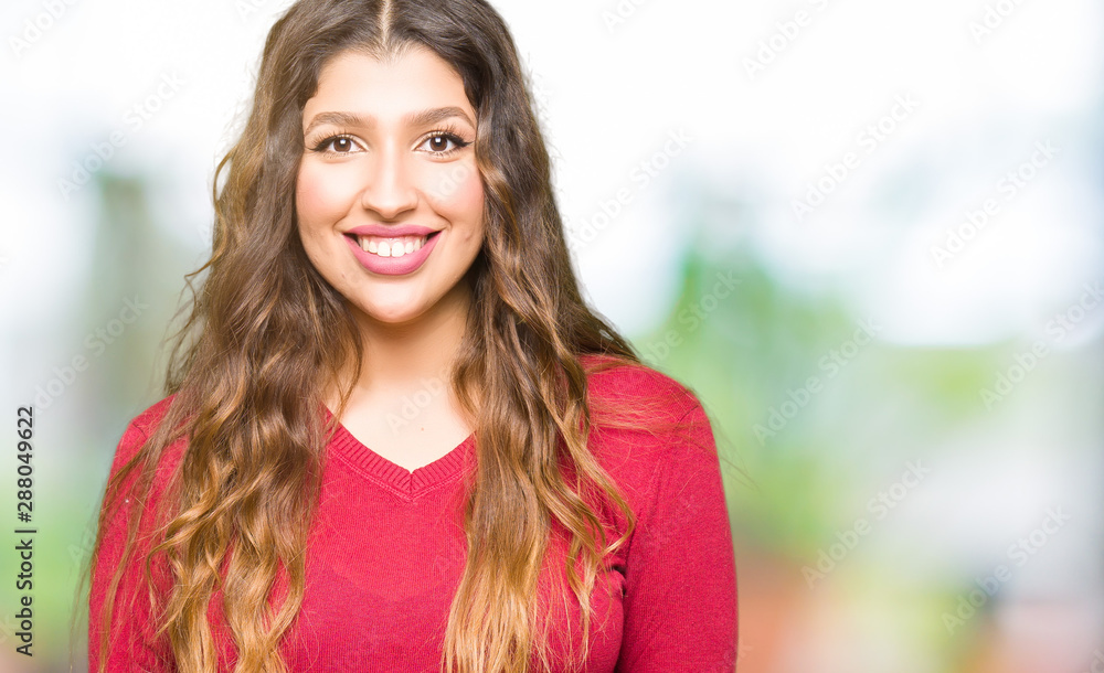Young beautiful woman wearing red sweater with a happy and cool smile on face. Lucky person. Young beautiful woman wearing red sweater with a happy and cool smile on face. Lucky person.