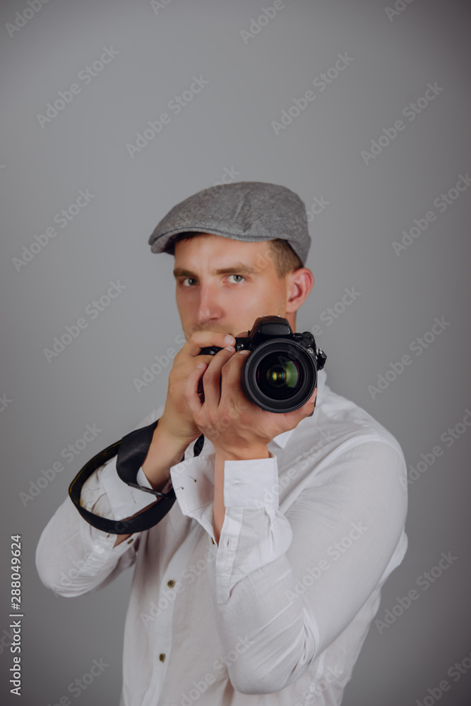 Young man using a professional camera Young man using a professional camera