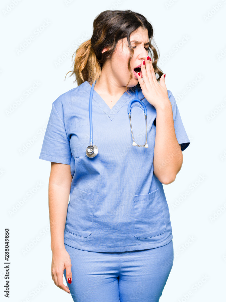 Young adult doctor woman wearing medical uniform bored yawning tired covering mouth with hand. Restless and sleepiness. Young adult doctor woman wearing medical uniform bored yawning tired covering mouth with hand. Restless and sleepiness.