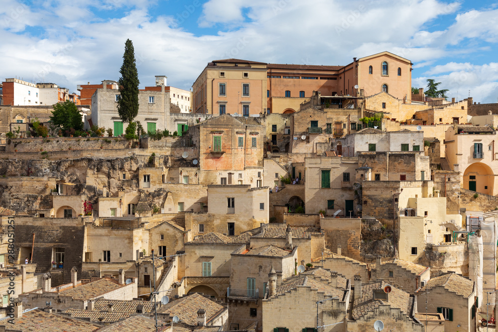 Obraz premium Italy, Basilicata, Province of Matera, Matera. Old stone buildings on a steep hillside.