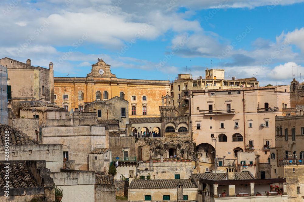 Italy, Basilicata, Province of Matera, Matera. Old stone buildings on a steep hillside.