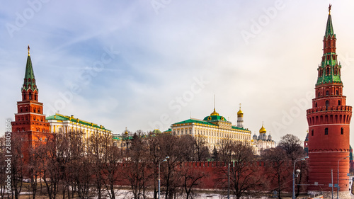 Panoramic view at Kremlin surrounding red walls with Borovitskaya and Vodovzvodnaya Towers, Cathedral of the Annunciation in background, Moscow Russia
