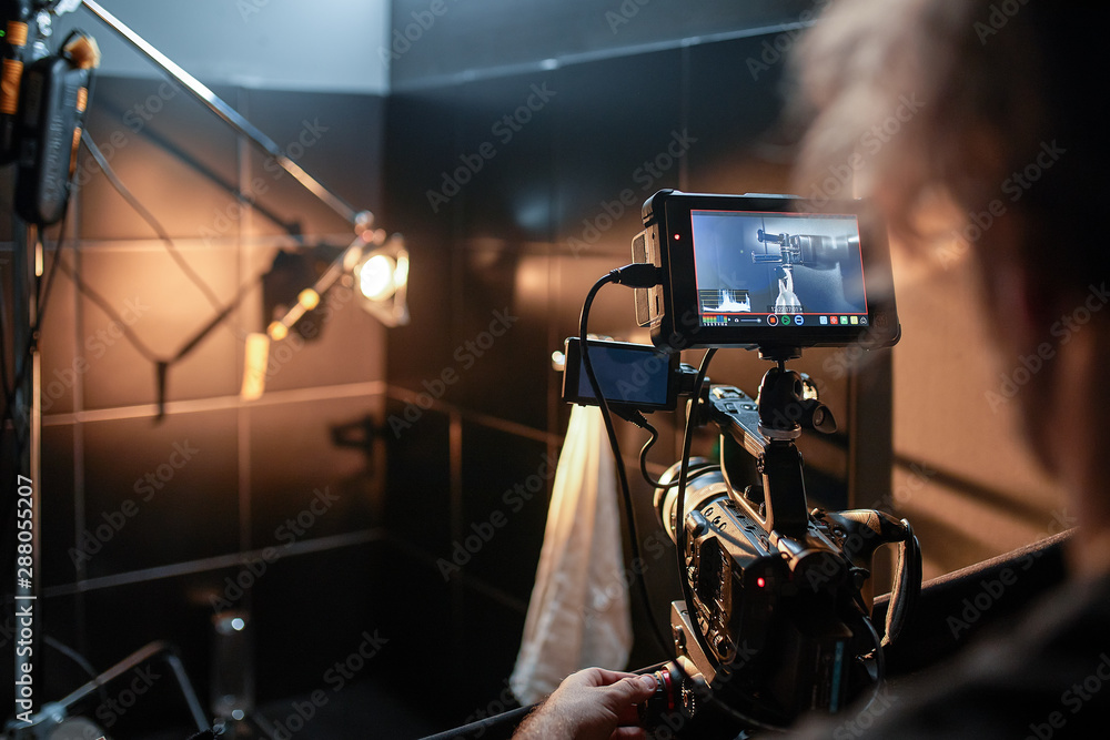 Behind the scenes of filming movies and video products, setting up equipment for shooting video and sound. The concept of producing video content for social networks, TV and blogs.