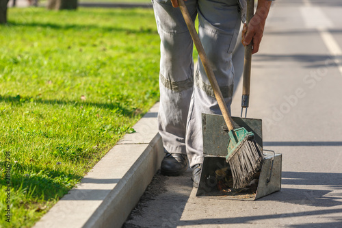 A sweeper cleans streets of trash