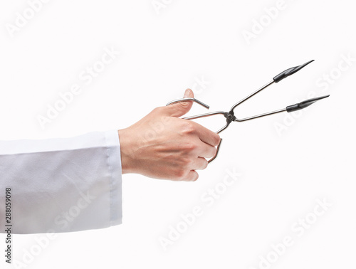 Man hand using an opened kitchen tongs isolated on a white background