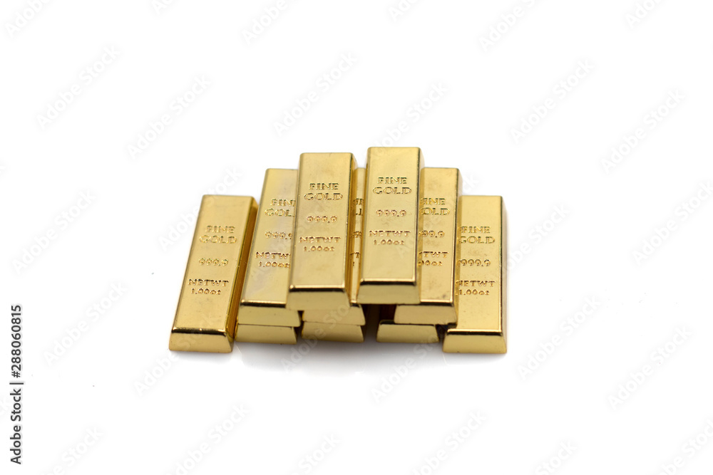 A stack of gold bars isolated on a clean, white background.  Shot close up in macro.