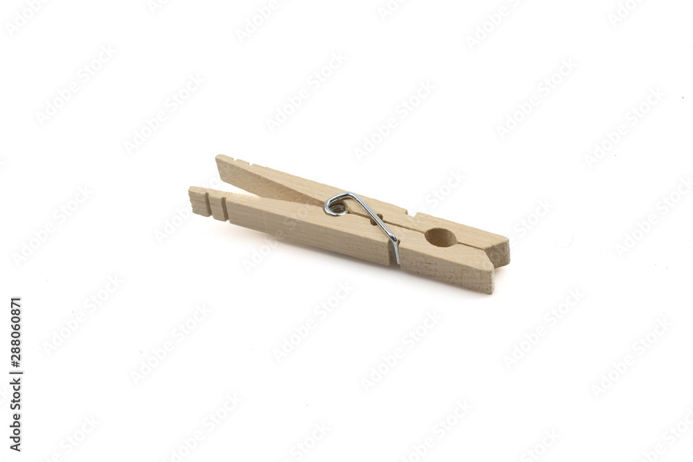 A close up macro shot of a wooden clothespin isolated on a clean, white background A close up macro shot of a wooden clothespin isolated on a clean, white background