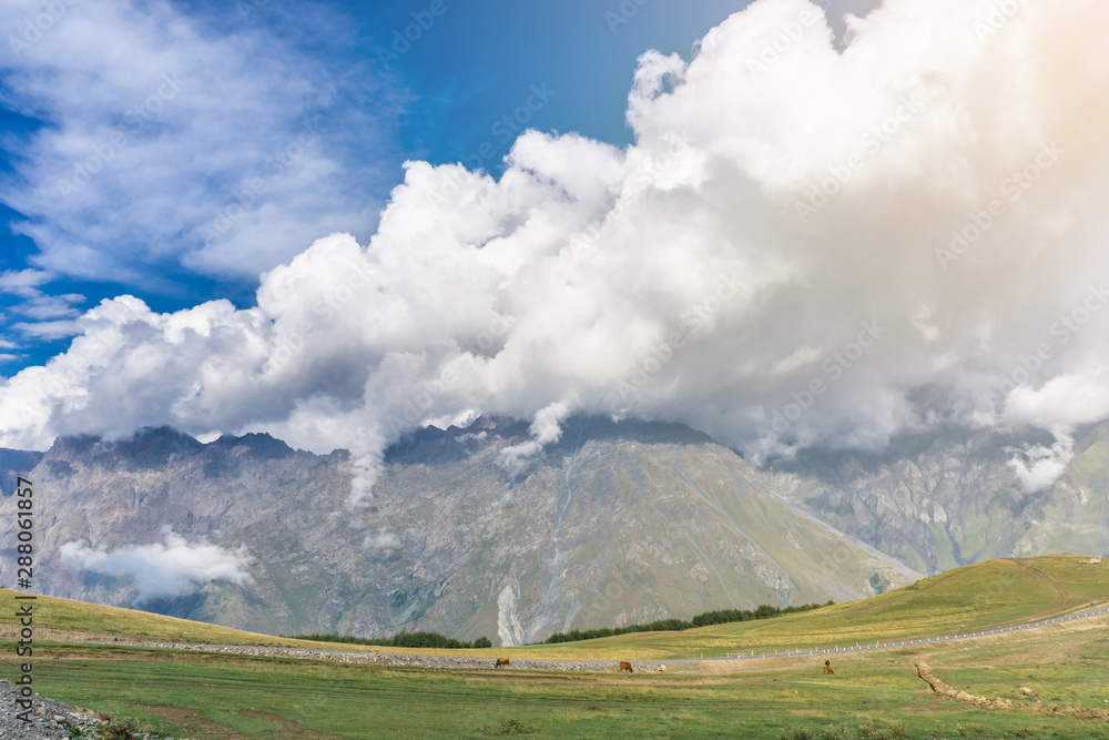 Fototapeta premium Mountains in Georgia in the rays of the setting sun