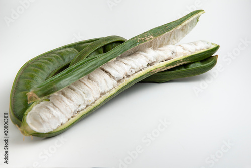 Guaba or cuaniquil: fresh South American fruit on white background