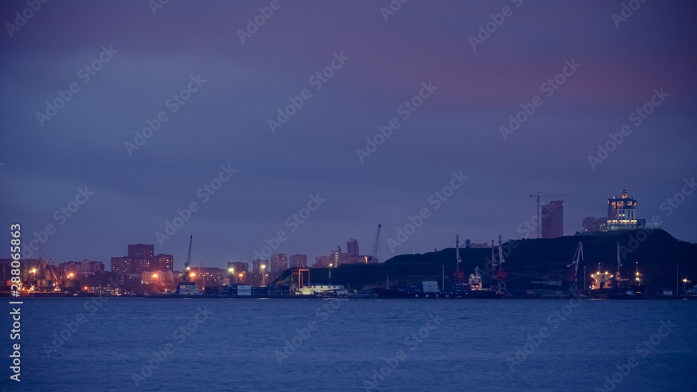 Seascape with coastline in blue hour. Vladivostok, Russia