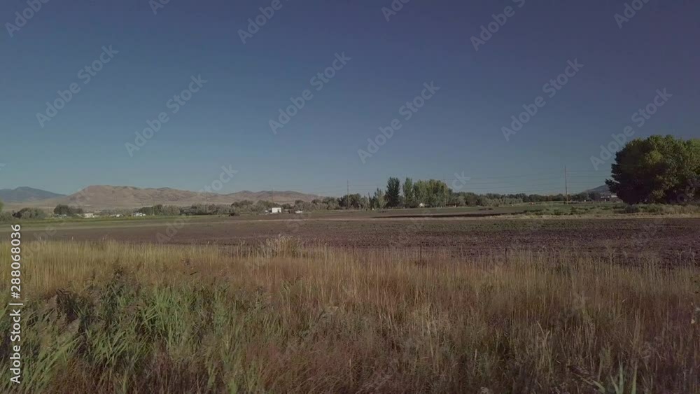 Fast sliding view of farm land as seen from a drone or vehicle Fast sliding view of farm land as seen from a drone or vehicle